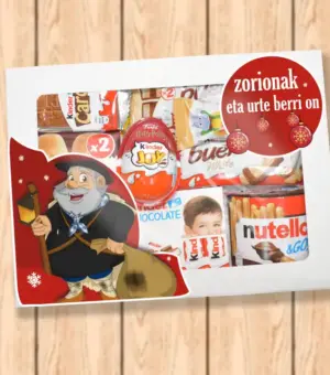 Caja con ventana para ver el interior, con chocolates Kinder la caja va diseñada con Olentzero.