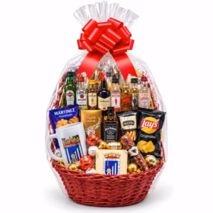 Cesta regalo gourmet con miniaturas de bebidas de 20 y 25 cl, chocolates, aperitivos y embutidos, presentada con lazo rojo.